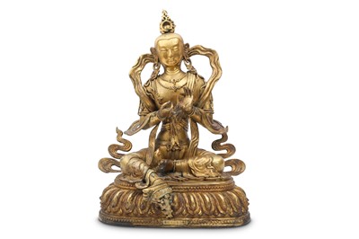 Lot 756 - A CHINESE GILT-BRONZE FIGURE OF A BODHISATTVA.