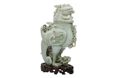 Lot 594 - A CHINESE APPLE-GREEN JADEITE 'DRAGON AND PHOENIX' VESSEL AND COVER.