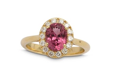 Lot 1298 - A purple spinel and diamond cluster ring