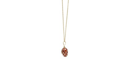 Lot 1285 - An enamel egg pendant necklace