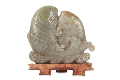 Lot 671 - A CHINESE PALE CELADON JADE 'DOUBLE FISH' CARVING.