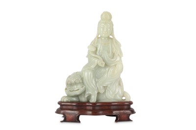 Lot 261 - A LARGE CHINESE PALE CELADON JADE FIGURE OF GUANYIN.