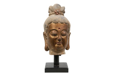 Lot 217 - A LARGE CHINESE POLYCHROME AND GILT STUCCO HEAD OF A BUDDHA.