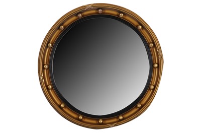Lot 77 - AN EARLY 20TH CENTURY REGENCY STYLE CIRCULAR MIRROR