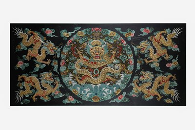 Lot 104 - A CHINESE RECTANGULAR BLACK-GROUND EMBROIDERED SILK 'DRAGON' PANEL.