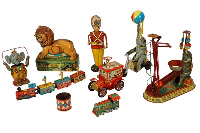 Lot 89 - A 1950'S TIN PLATE TOY ELEPHANT RIDING A CYCLE