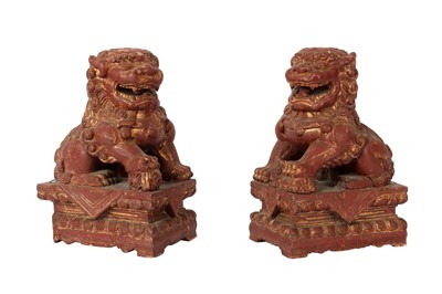 Lot 566 - A PAIR OF CHINESE GILT-LACQUER LION DOGS.