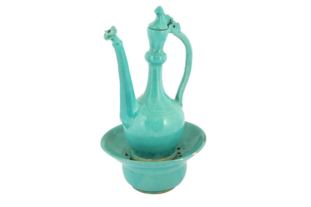 Lot 71 - A SAFAVID TURQUOISE MONOCHROME POTTERY EWER AND BASIN