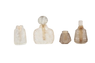 Lot 152 - FOUR CARVED ROCK CRYSTAL MINIATURE SCENT BOTTLES