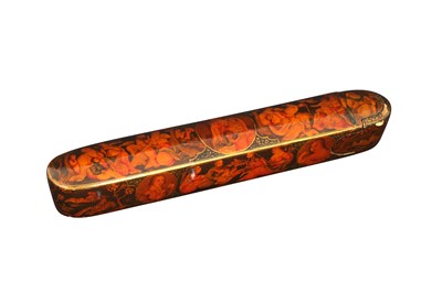 Lot 286 - A QAJAR LACQUERED PAPIER-MÂCHÉ QALAMDAN (PEN BOX)