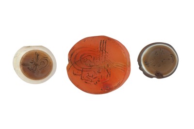 Lot 108 - THREE HARDSTONE INTAGLIOS WITH OTTOMAN SULTANS' TUGHRAS