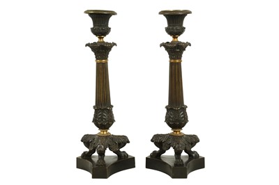 Lot 117 - A PAIR OF REGENCY BRONZE AND PARCEL GILT CANDLESTICKS