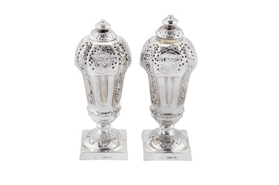 Lot 365 - A pair of Victorian sterling silver pepper casters, London 1880 by Robert Harper