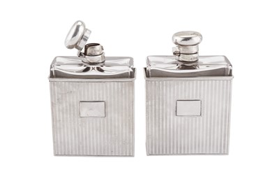 Lot 70 - A pair of Edwardian/George V Art Deco sterling silver mounted glass cologne or scent bottles, London 1907/12 by Samuel Jacob
