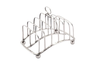 Lot 386 - A George III provincial sterling silver seven bar toast rack, Newcastle circa 1815 John Robertson II & John Walton (active 4th Oct 1811 – 1st Dec 1820)