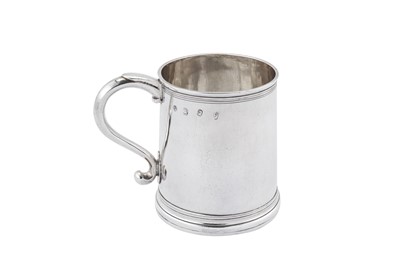 Lot 445 - A Queen Anne Britannia standard silver mug, London 1710 by John Fawdry I (reg. April 1697)