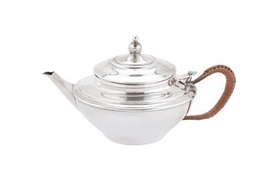 Lot 266 - A George V ‘Arts and Crafts’ sterling silver green tea teapot, London 1911 by William Arthur Smith Benson (1854-1924)