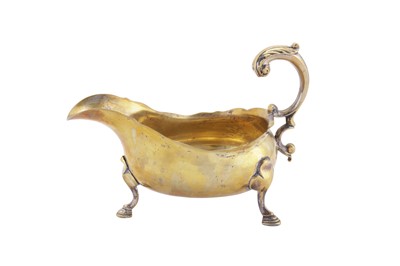 Lot 253 - A large George II French plate brass sauceboat, probably London circa 1740