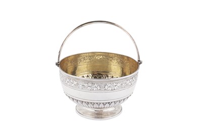 Lot 455 - A Victorian sterling silver sugar basket, London 1878 by Henry Holland