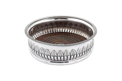 Lot 389 - A George III sterling silver wine coaster, Sheffield 1812 by James Kirkby & Co