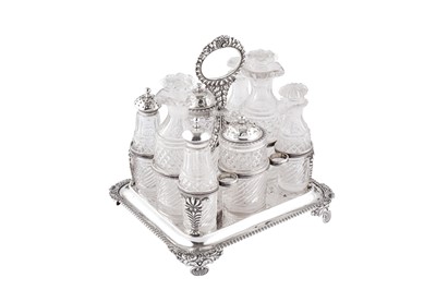 Lot 368 - A George III sterling silver eight bottle cruet, London 1819 by William Barret II
