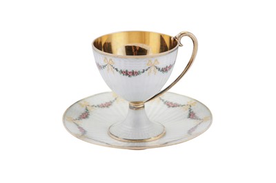 Lot 84 - An early 20th century Norwegian 930 standard silver gilt and guilloche enamel cup and saucer, Bergen circa 1910 by Marius Hammer