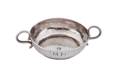 Lot 105 - A William and Mary silver miniature or toy wine taster, London circa 1690, maker’s mark only IC above a pellet