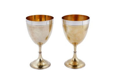 Lot 335 - A pair of large Victorian sterling silver parcel gilt goblets, London 1869 by Daniel and Charles Houle