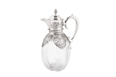 Lot 320 - An Edwardian sterling silver mounted cut glass claret jug, London 1904 by William Comyns