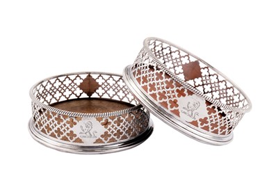 Lot 406 - A pair of George III sterling silver wine coasters, London 1769 by Edward Lowe