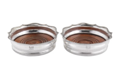 Lot 407 - A pair of George III sterling silver wine coasters, London 1808 by Charles Chesterman II