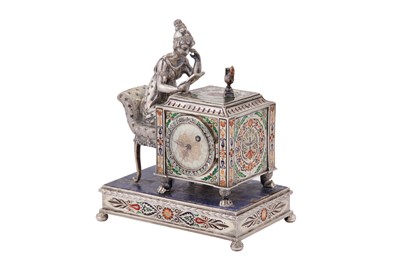 Lot 88 - An early 20th century Austrian unmarked silver and champlevé enamel figural table timepiece, probably Vienna circa 1910