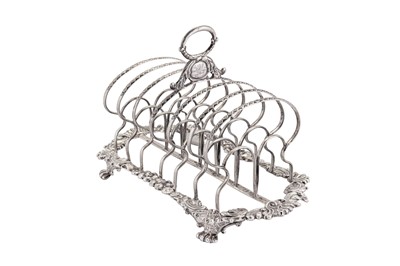 Lot 375 - A George IV sterling silver seven bar toast rack, Sheffield 1820 by Thomas & John Settle (reg. June 1815)