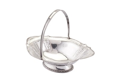Lot 392 - A George III Irish sterling silver bread basket, Dublin 1797 by Richard Williams