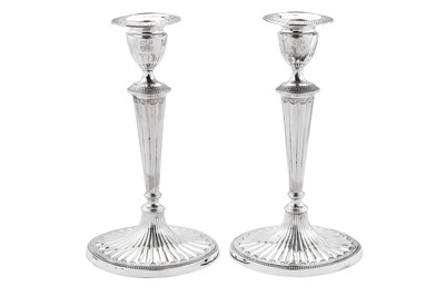 Lot 415 - A pair of George III sterling silver candlesticks, Sheffield 1785 by John Parsons & Co