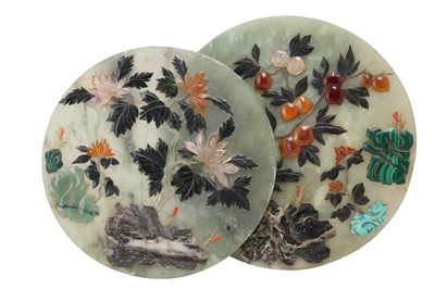 Lot 385 - λ TWO CHINESE HARDSTONE-INLAID PALE CELADON JADE CIRCULAR PANELS.