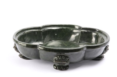 Lot 633 - A LARGE CHINESE SPINACH-GREEN JADE QUATREFOIL JARDINIERE.