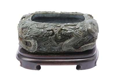 Lot 547 - A MASSIVE CHINESE SPINACH-GREEN JADE WASHER.
