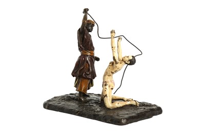 Lot 1042 - FRANZ BERGMAN (IN THE MANNER OF) A COLD PAINTED BRONZE MODEL OF A SLAVE TRADER AND NUDE SLAVE