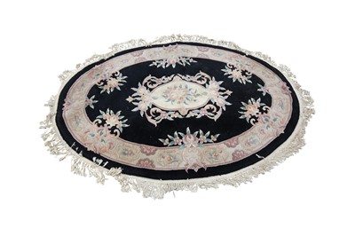 Lot 309 - A CHINESE OVAL WOOL RUG, 20TH CENTURY