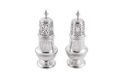 Lot 435 - A pair of George II sterling silver ‘portrait’ sugar casters, London 1731/34 by Thomas Tearle
