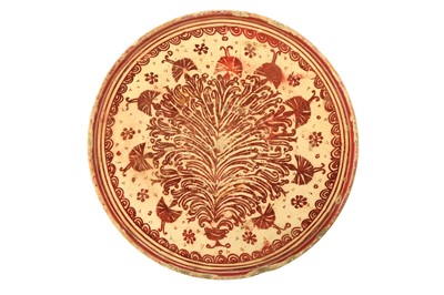 Lot 85 - AN HISPANO-MORESQUE COPPER LUSTRE-PAINTED POTTERY TAZZA