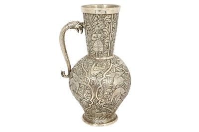 Lot 208 - A CAUCASIAN (GEORGIAN) REPOUSSÉ AND ENGRAVED SILVER JUG
