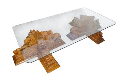 Lot 457 - A LARGE GLASS LOW TABLE WITH MODERN INDIAN CARVED WOOD LEGS