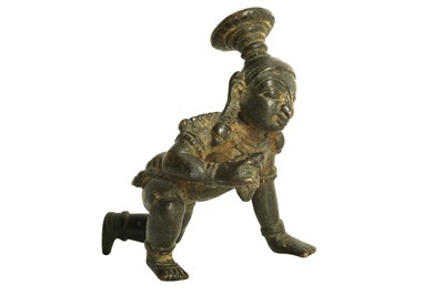 Lot 227 - A CRAWLING BALA KRISHNA BRONZE STATUETTE