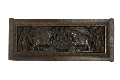 Lot 262 - A CARVED WOODEN LINTEL PANEL WITH THE HINDU GODDESS GAJA LAKSHMI