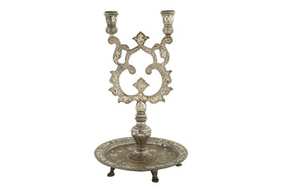 Lot 366 - A DOUBLE-PRONGED BIDRI SILVER-INLAID CANDLESTICK