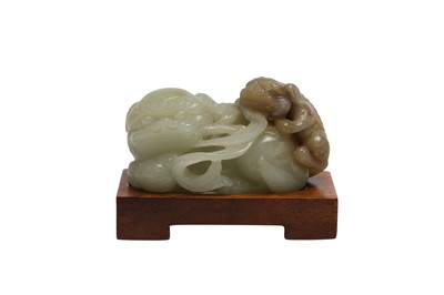 Lot 872 - A CHINESE PALE CELADON JADE 'LION DOGS' GROUP.