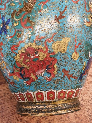 Lot 35 - A CHINESE GILT BRONZE AND CLOISONNÉ ENAMEL 'LION DOGS' BUDDHIST LONGEVITY VASE, BUMPA.
