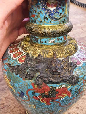 Lot 35 - A CHINESE GILT BRONZE AND CLOISONNÉ ENAMEL 'LION DOGS' BUDDHIST LONGEVITY VASE, BUMPA.